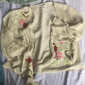 Light and flowing top. 100% silk with beautiful embroidered flowers.